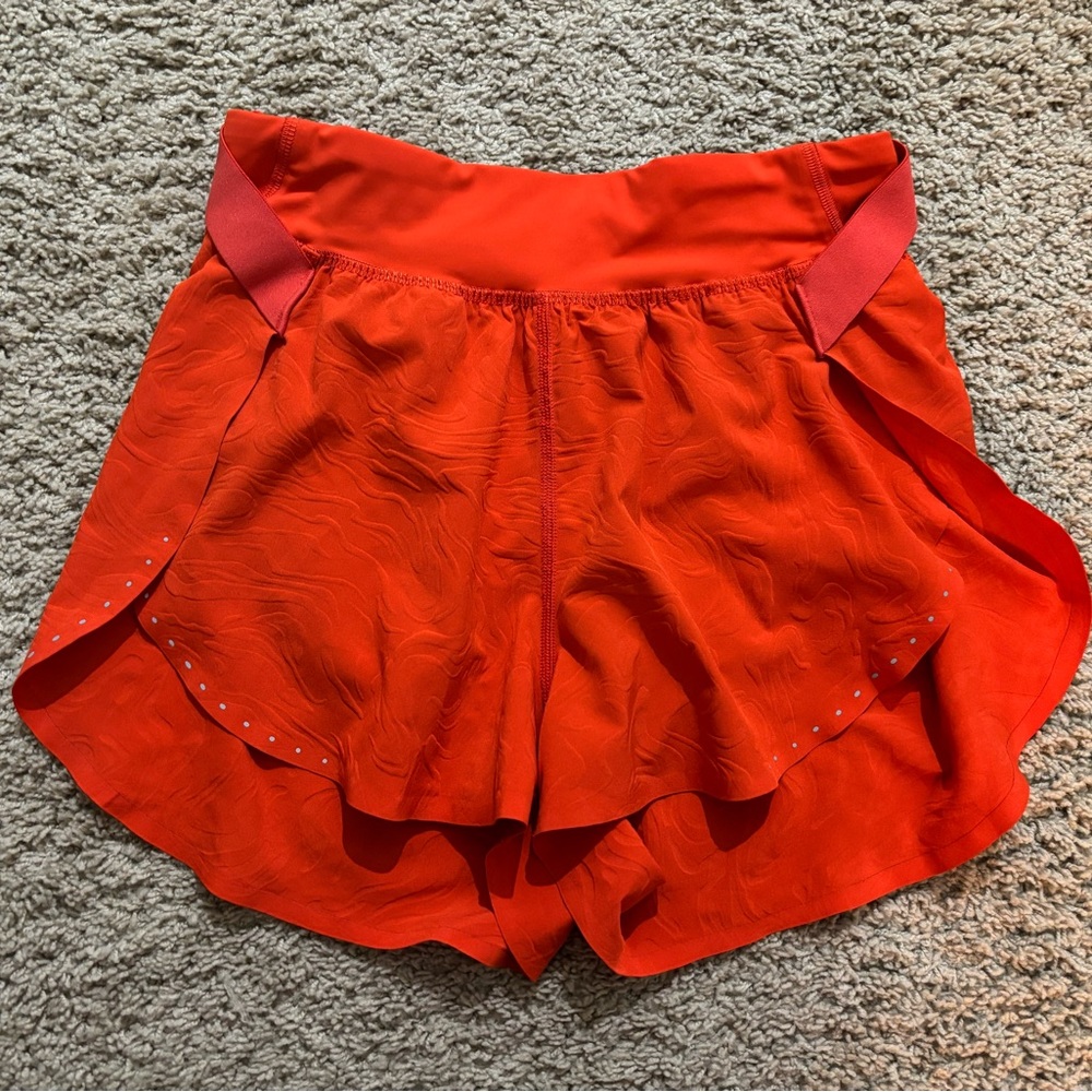 Lululemon Fast and Free HR Airflow embossed color solar orange (red) shorts